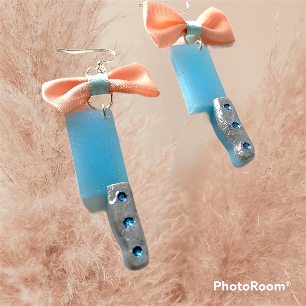 Kawaii style blue and silver sparkle cleaver, axe dangle earrings with pink bow